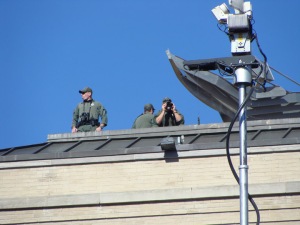 Rooftop security at the parade site. Helicopters and undercover security were also utilized.